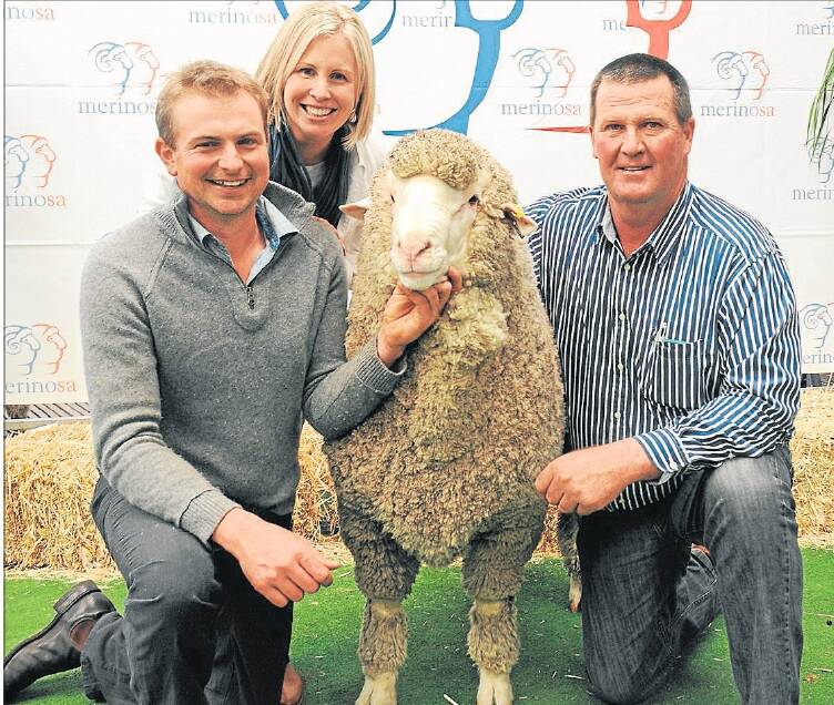 2014: Tom and Laura Davidson, Moorundie Park stud, Gulnare, with the buyer of their $53,000 ram, Nigel Kerin, Kerin Poll, Yeoval, NSW. The ram, also known as the Kelvinator, was the grand champion autumn-shorn Poll Merino ram and winner of the Fibre Meat Plus class.