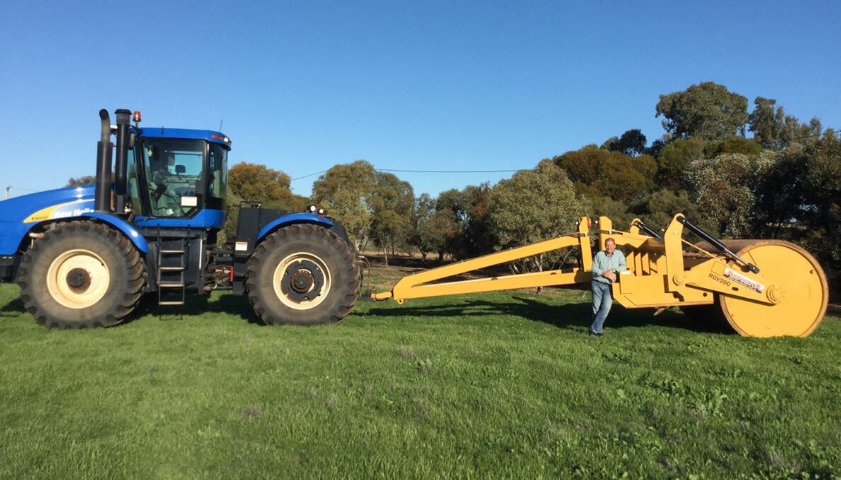 BIG GRUNT: SA contractor Scott Newbold with his 3-metre Reefinator machine, towed behind a 500-horsepower New Holland T9050 tractor.