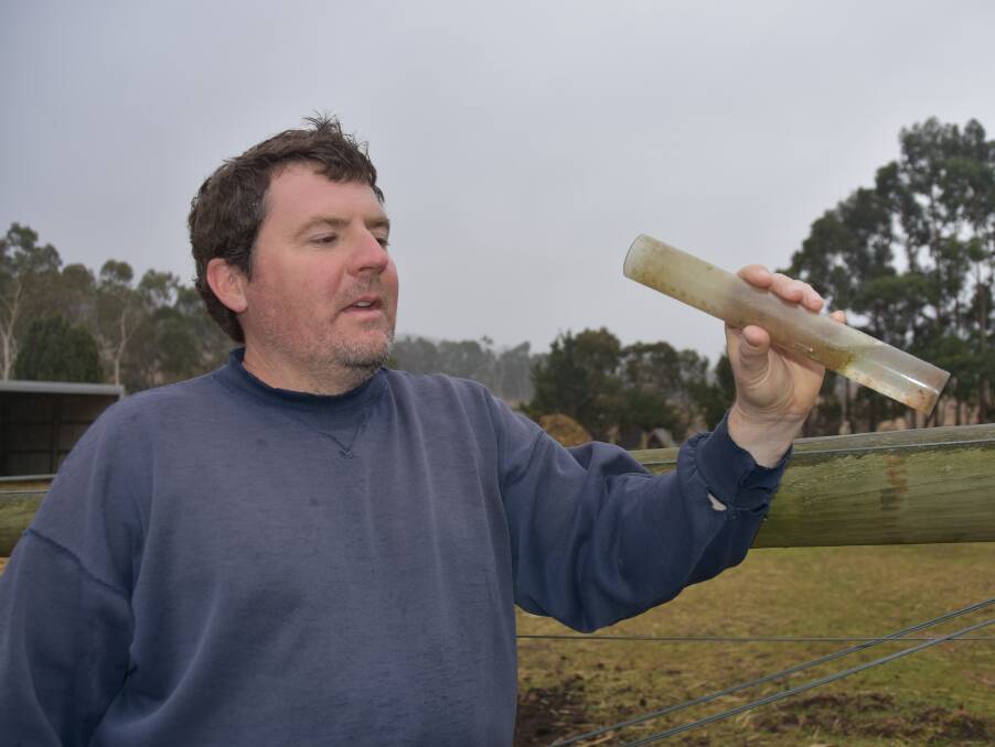 HAY AWAY: Woodside farmer Jim Franklin-McEvoy checking the rain gauge after 13.5mm fell at his property on Tuesday, and a further 28mm last week. He plans to get on with sowing hay once the sun comes out. 