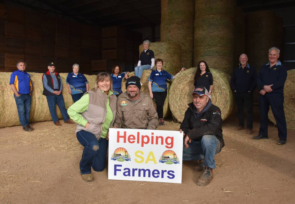 HELPING HAND: Rotary recently partnered with Helping SA Farmers to deliver hay to drought-affected pastoralists. Pictured: (at back) Jim Silvestri and Benny Bosman from Rotary Campbelltown; Margaret Farr, Vinetta Dogra, Linda Young and Jeanette Rich from Rotary Mawson Lakes; and Tania Dalton, Des Munro and John Caddy from Rotary Burnside. Front: Hay run organisers Lisa and Pete Vassalo from HSAF and hay producer and donator Greg Damiani.