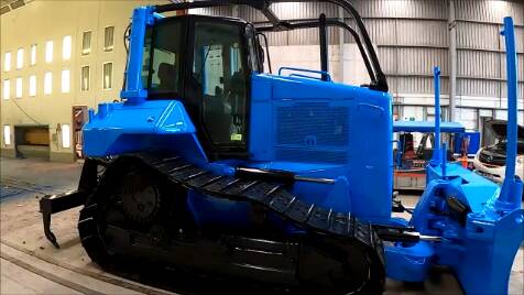 The bright blue D6 dozer is going to be hard to miss on the road, and its owners hope it starts important conversations about mental health.