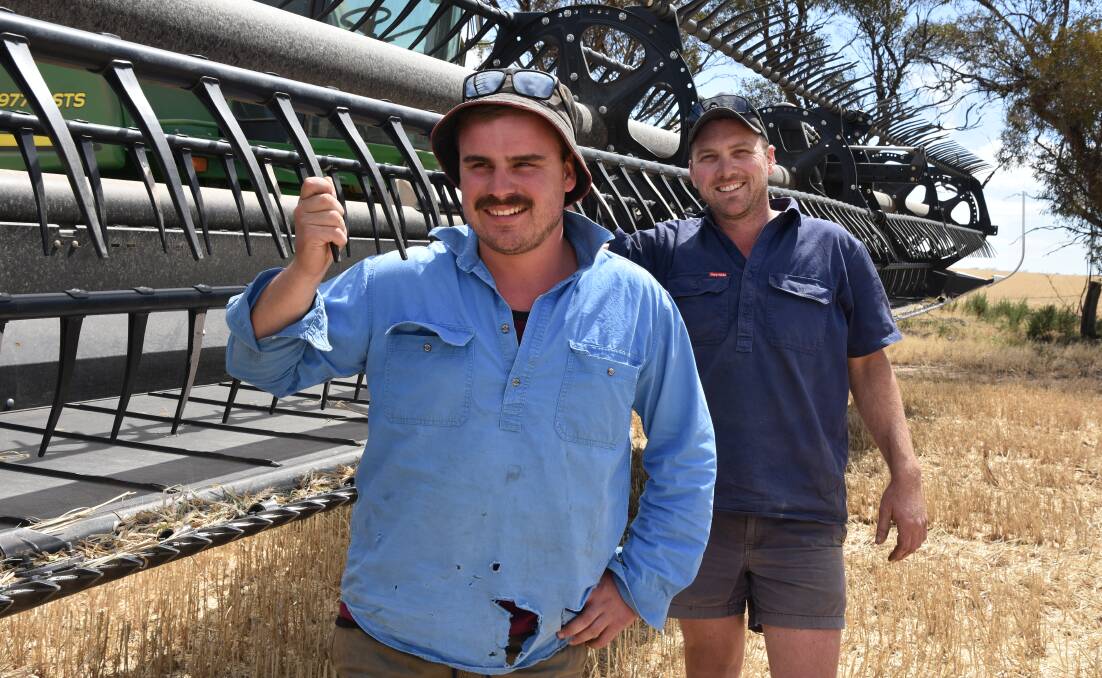 REEL HAPPY: Tyler 'Boo' Hayden and Xavier Breen harvesting wheat at Mr Breen's property at Pullut, near Rainbow, in the southern Mallee in Victoria. 