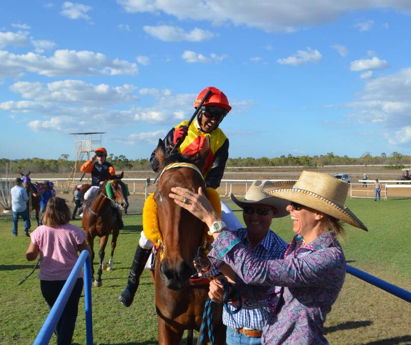 Jubilant trio: Robert and Sally Kirkwood were over the moon after Cracow and his thrilled jockey Jeffrey Felix won the Charters Towers Amateur Cup.