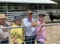 PRIME: Co-principals Colin Flanagan and Pat Ebert welcomed visitors from NSW and across Victoria, including Ray and Bev Parsons, Kyabram. Onlookers were interested in the 41 young bulls that will be offered at the on-property bull sale on 31 March. Known for their weight for age and carcase quality, Prime Angus is establishing a name as producing profitable genetics. Pictured with lot 13, R130 and 16 month old. 
“When you breed for pedigree, the EBVs just come,” Mr Flanagan said.  