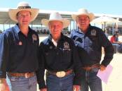 Mitch Semmens, Nutrien Quilpie, and Terry Ryan, Nutrien Chinchilla, working as barrier attendants, with legendary race starter Larry Lewis.