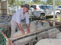 Lansdowne's Chris Turnbull inspecting sheep at a show. Picture: Bushshutterman Photography 