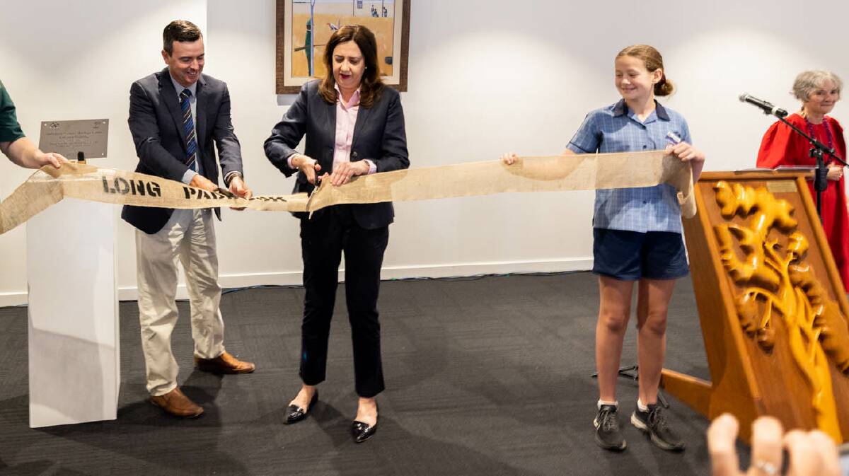Barcaldine Mayor Sean Dillon assists Premier Annastacia Palaszczuk cut the ribbon to open the revamped Australian Workers' Heritage Centre. The speaker's lectern has been crafted from Tree of Knowledge timber. Photo - Aaron Skinn.
