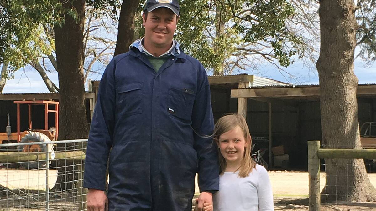 SAFETY FIRST: Mark Hammond with daughter Amber on their Gippsland farm, where the family has clear rules to keep the children safe.