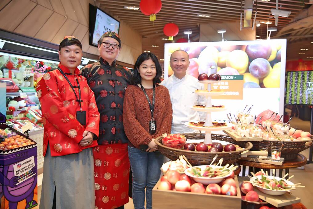 ON SHOW: Part of the Australian stonefruit promotional team at retail chain, City Super, in China, showing off fruit and giving away samples.