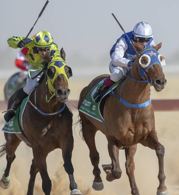 Runner-up at last year's Birdsville Cup Eschiele (green cap) ridden by Les Tilley to French Hussler (white cap) won the Diggers' Cup at Longreach on May 2 for Barcaldine trainer Todd Austin. Picture: Racing Queensland
