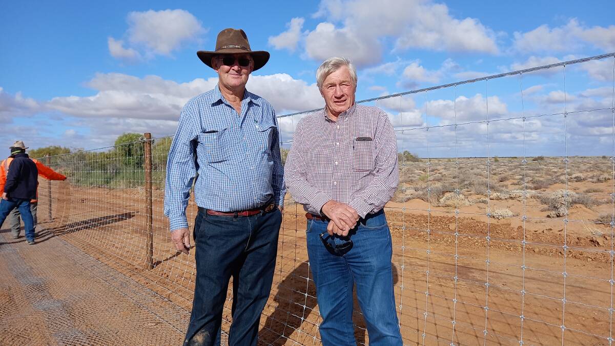 WORK COMPLETED: Marree Local Dog Fence Board chair Peter Litchfield and SA Dog Fence Board chair Geoff Power inspect the rebuild. 