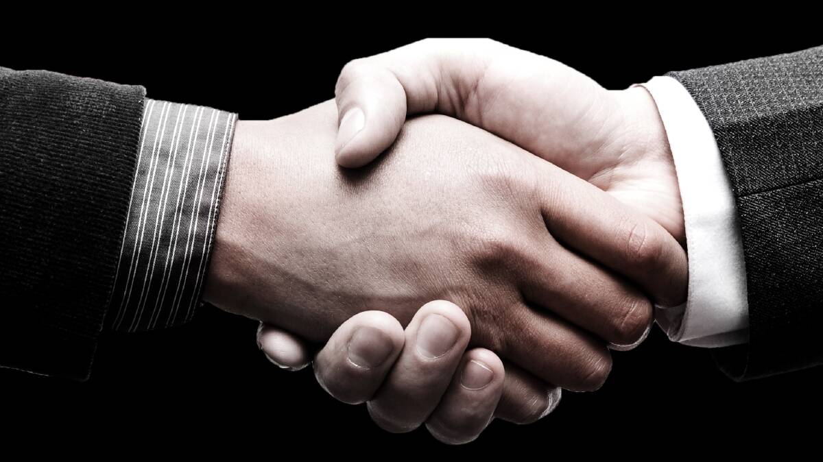 Lots of farming deals are done verbally, usually with a handshake. Photo: SHUTTERSTOCK