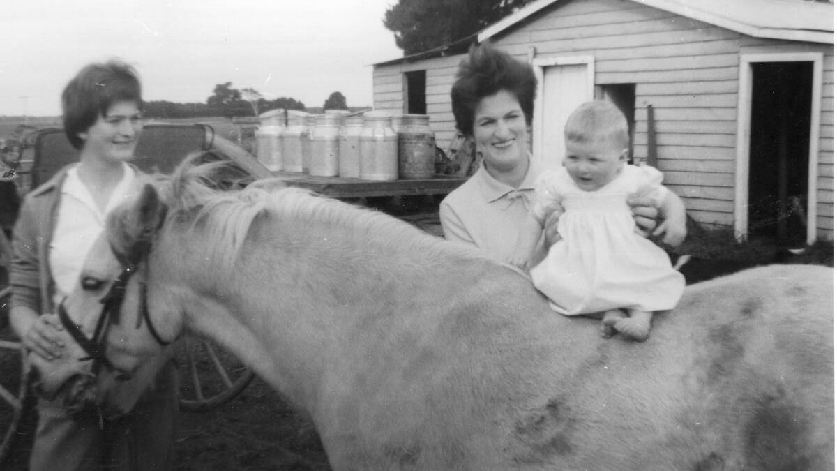 FARM LIFE: Elaine Harfull (centre) with daughters Valerie and Elizabeth on pony Snowy outside their Mil Lel dairy near Mount Gambier in 1962. 