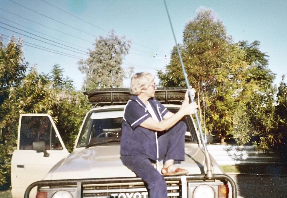 NEW WHEELS: Toni Vansyl, who was on the Sandover Mobile out of Alice Springs, NT,  sets up the radio aerial on the new Toyota four-wheel-drive in the 1980s.