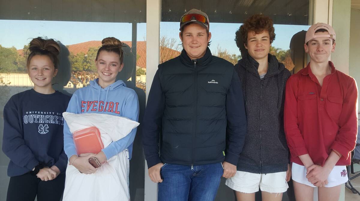 ISOLATION FAMILY: Maggie Siemer, Maddie Baxter, Harry and Charlie Siemer and Ned Davies, all from Broken Hill, NSW, isolated together in April before returning to school.