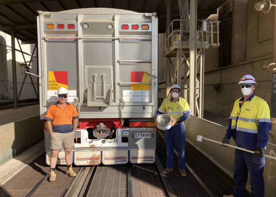 Ben Bussenschutt, Mambray Creek, with Viterra employees Tim Sherwood and David Bateman, after delivering the first load of barley into the Port Pirie site.