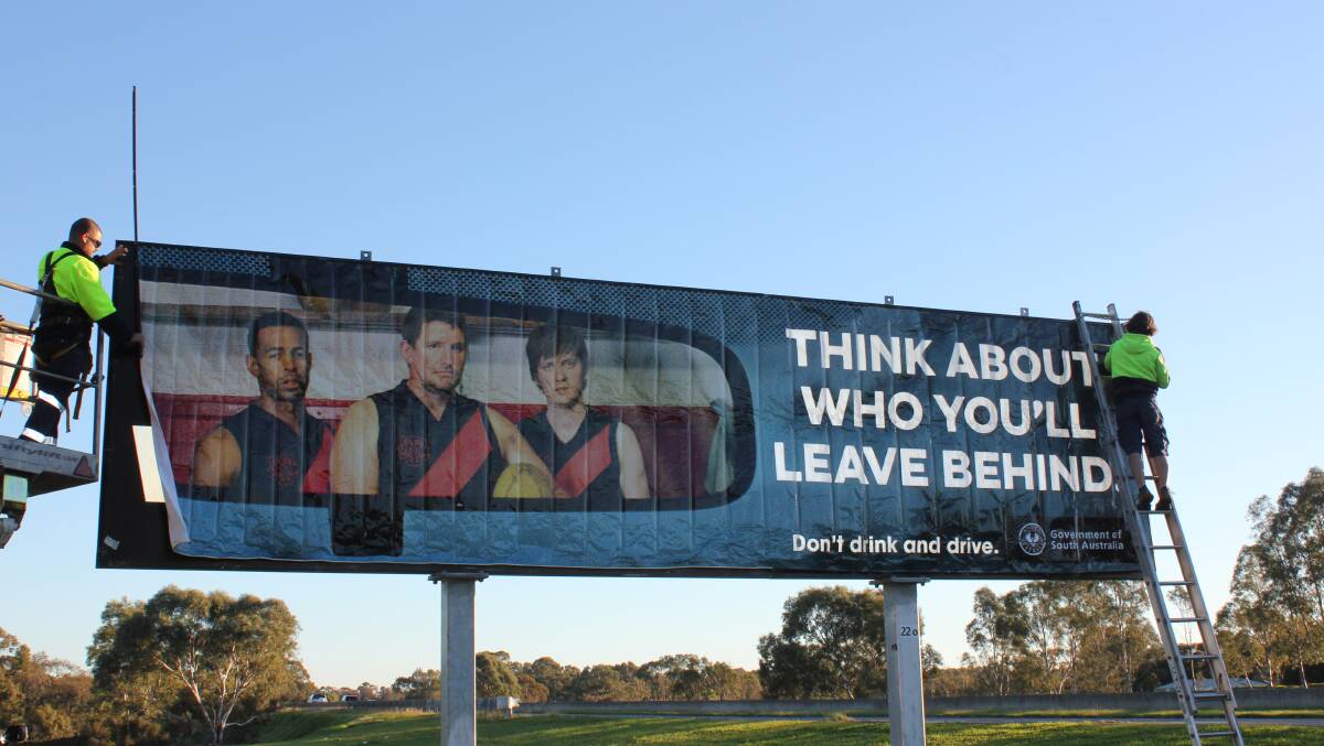 HANDY REMINDER: A billboard from the new road safety campaign being installed near Gawler. Photo: SAPOL