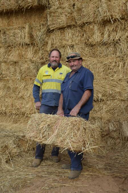 FODDER TIME: Garry Vivian, Milang, and hay producer Max Dix, Finniss, have been kept busy with hay deliveries as an increasing number of livestock producers are forced to look for feed.