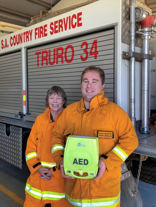 SAFETY FIRST: CFS Truro Brigade president Sally Fox and Captain Matt Saegenschnitter with a defibrillator funded by RAAs 2018-19 Regional Safety Grants. 