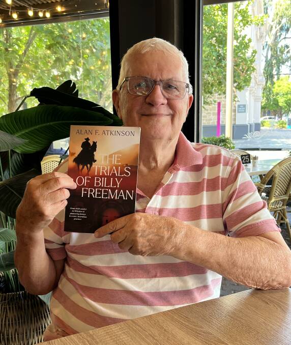 Author Alan F Atkinson with his book about the life of a "colourful" ancestor, convict Billy Freeman. Picture by Elizabeth Anderson