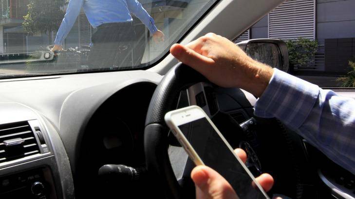  An RAA survey found 42pc of participants rated distracted drivers, such as through mobile phones, were a major road safety concern. Photo: SHUTTERSTOCK