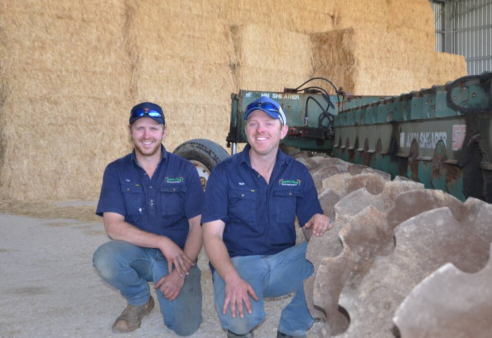 NEXT LEVEL: Tim and Matt Eckert, Malinong, next to the Plozza plough and in front of their award-winning hay.