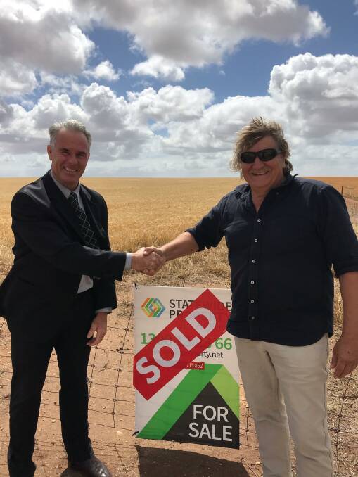 STAND-OUT: Statewide Rural's Rob Stephens with vendor Barry Lutze after the record-breaking sale of the east YP property. 