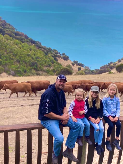 GOOD MATCH: Brodie Howard with daughters Indy, Airlie and Marni, and their South Devons in front of the Dudley Wines cellar door at Penneshaw. Photo: KATE HOWARD