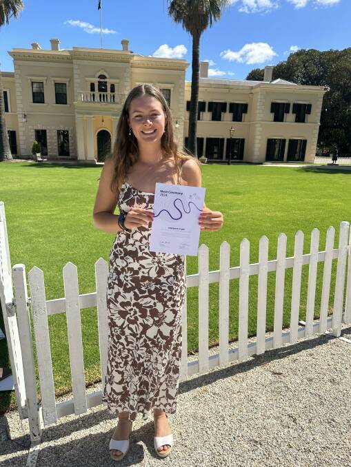 Lucy Bussenchutts, Kadina, with her Merit certificate at Government House. Picture supplied