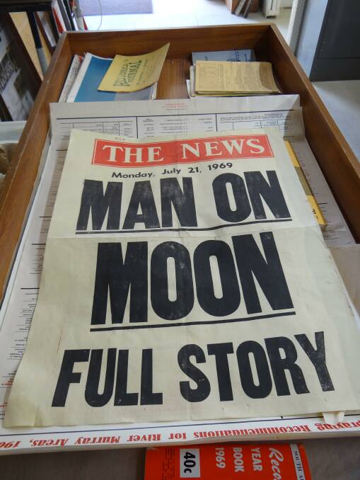 Relics retrieved from inside the time capsule revealed what was making news in 1969 - including the moon landing. Photos: SUE SCHEIFFERS