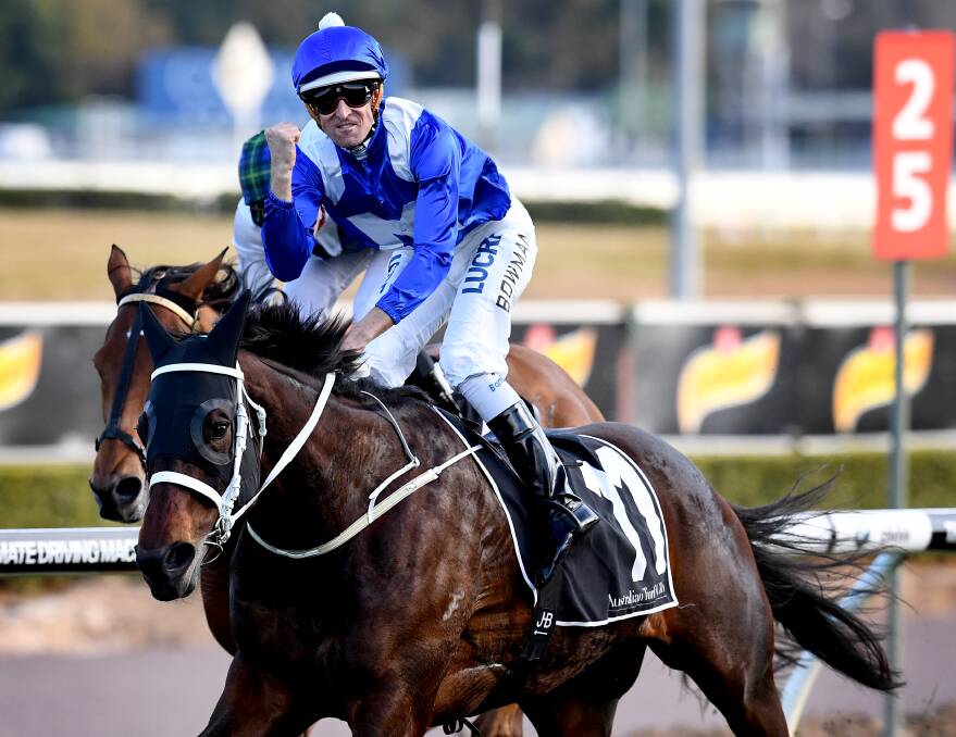 YOU BEAUTY: Jockey Hugh Bowman gives a fist pump as the might mare Winx romps away with another big race.