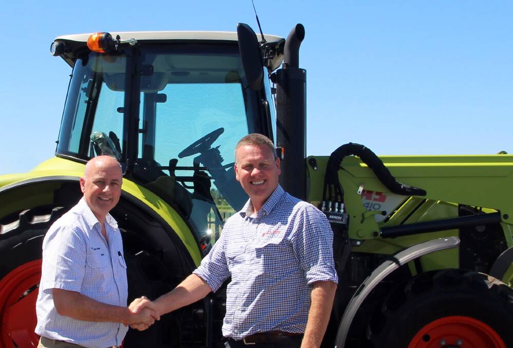 SHAKE ON IT: Landpower's Tim Needham welcomes Wideland Group managing director Mick McDonald to the Claas Harvest Centre farm machinery dealerships network. 