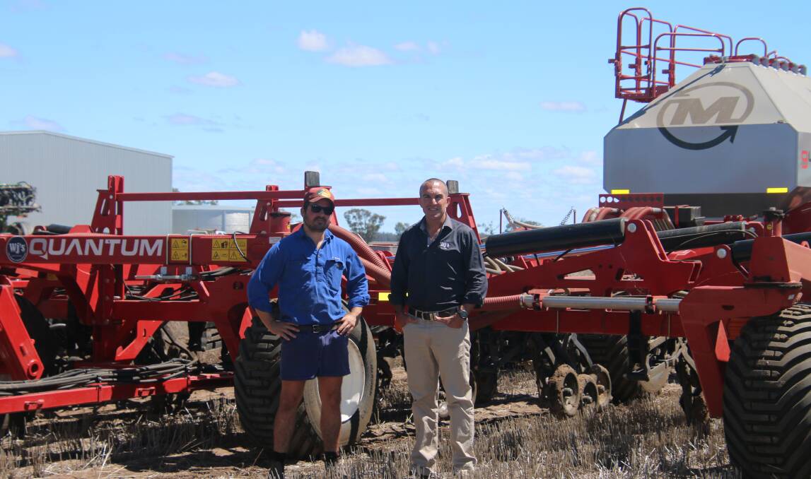 PLEASED AT PALLAMALLAWA: Moree-region agricultural contractor Jordan Cosh and Jeremy Matthews from Morris dealer, WJ Matthews at Moree, discuss the performance of Mr Cosh's 18-metre Quantum air drill.
