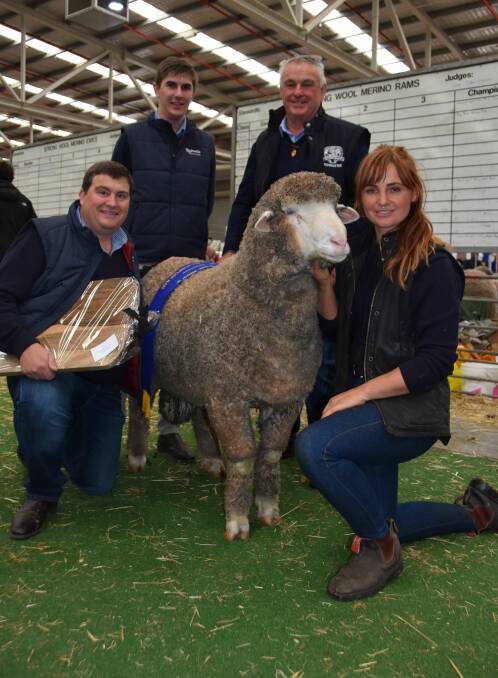 ALL-PURPOSE: Ross and Claire McGauchie, Terrick West, Prairie, and Rodwells wool manager Michael Dekleuver, with wool graduate Damien Dore, holding the Australian champion all-purpose Merino exhibit. Photo by Catherine Miller. 