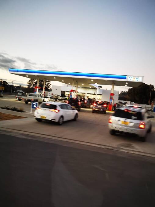 Cars were backed up at both petrol stations. Photo Robbie Smith.