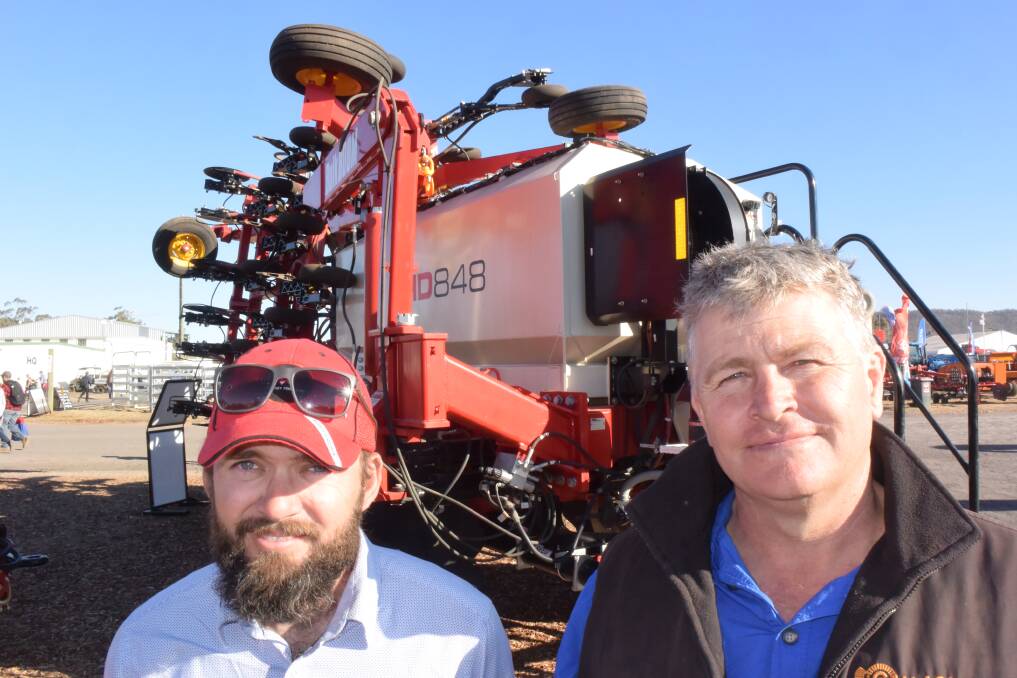 CANADIAN SEEDER: Leigh Dugan from Bourgault with Pomany Angus manager George Spring, looking over the Canadian built Bourgault LD 848 air seeder.
