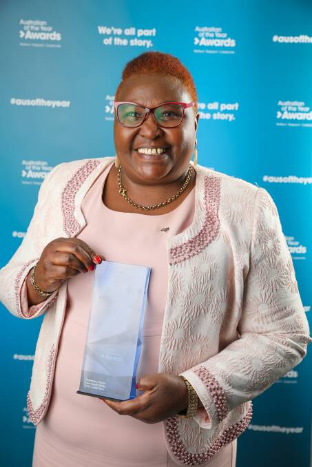Rosemary Kariuki with her state award. Picture: supplied by australianoftheyear.org.au