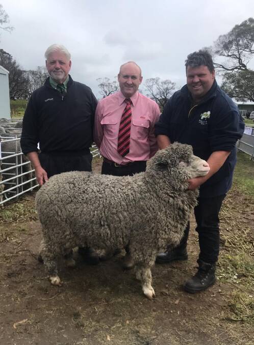 TOP RAM: Paul Jardine of Nutrien Ag and Greg Downing of Elders with Jared McArdle and the Lot 2 ram purchased by Phil Thompson of Yorketown for $2300. 