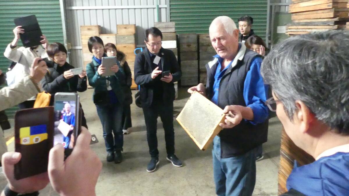 Island Beehive owner and founder Peter Davis speaks about beeswax to Japanese Palsystem delegates during their 2019 tour of Kangaroo Island organised by KI Pure Grain.