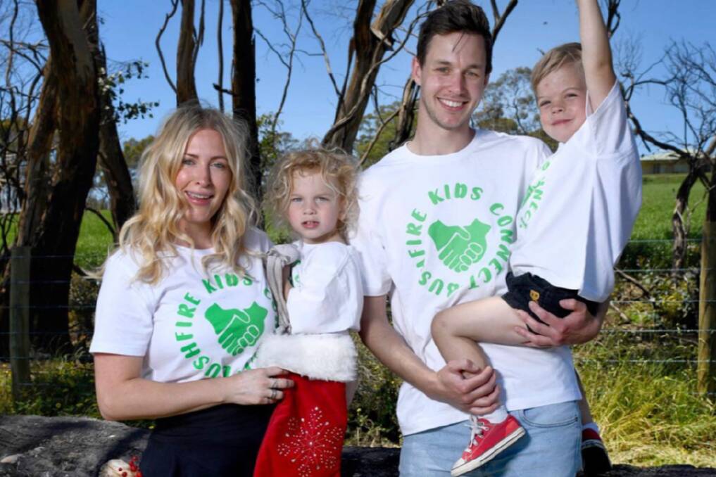 FINDING CONNECTIONS: Carly Ascott (holding son Harrison, 3, with neighbour Tim, and his son Archie, 5) is taking her Bushfire Kids Connect program national to help kids in other regions cope with disaster. Photo: NAOMI JELLICOE