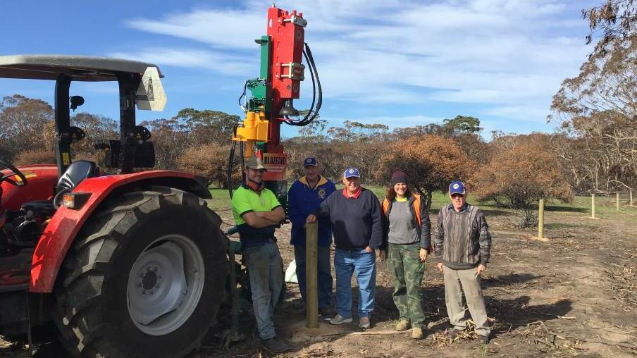 TRACTORS NEEDED: The official handover of the Munro post-hole digger to BlazeAid by the KI Lions Club back in May. Replacement tractors are now needed. 