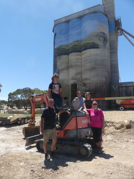 SILO FAMILY: Scott and Jude Shurven with kids Nick, Luke and Tayah on top Kev Warner's excavator. Photo: Stan Gorton 