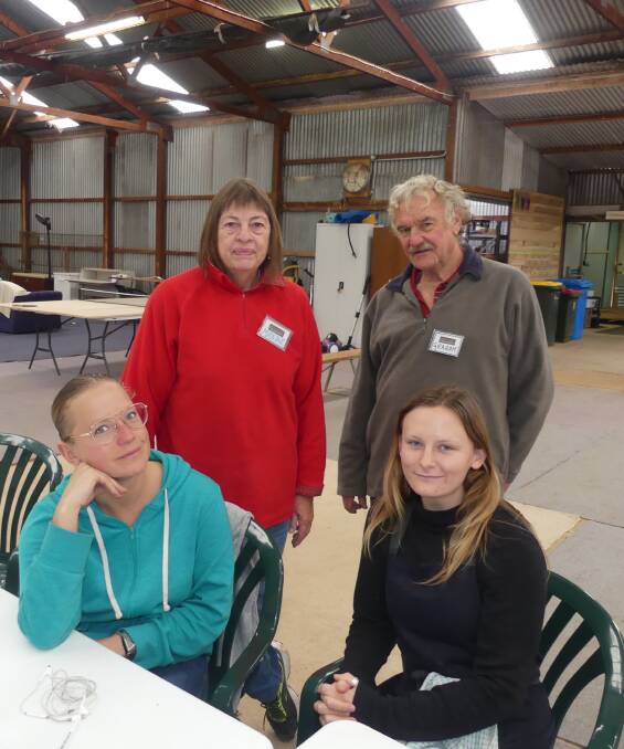 BlazeAid camp coordinators Maxine and Graham Norfolk at the Parndana Showground camp, with backpackers volunteers Kelly Geven from Stein, Holland, and Rikayla Baldin from Granite Island, Canada.
