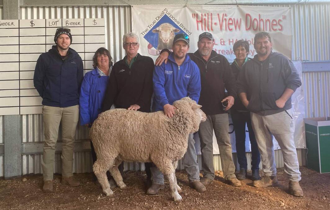 TOP RAM: The top-priced ram with Robert and Heather Holmes, Nutrien's Peter McEvoy, Milton Holmes, buyer Paul Webb, Rachelle Montgomerie and Jethro Holmes. 