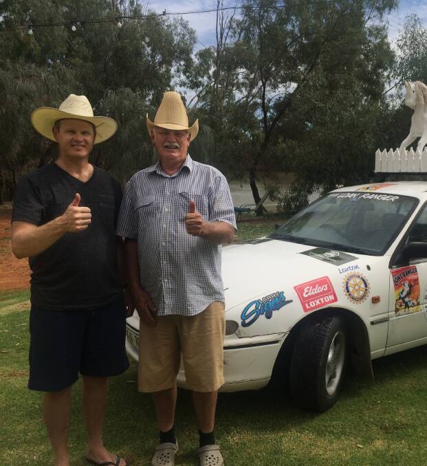 CHARITY TREK: Timothy and Noel Walker, Loxton, took part in a car rally from Adelaide to Cairns, Qld, raising funds for the Cancer Council. While they made it safely to Qld, their car broke down on the Oodnadatta Track.