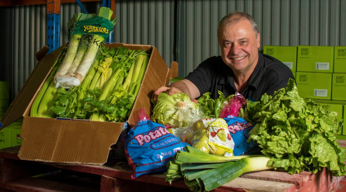 Independent Produce Suppliers director Frank Bueti, with some fresh produce which is moved from the Pooraka shed to more than 40 supermarkets in SA and NT.