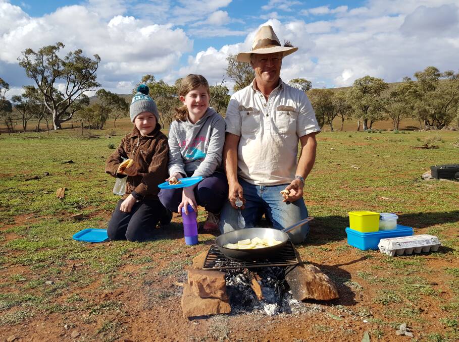 GREAT GETAWAY: Lachlan, Emily and Simon Hilder display their camping skills on Three Creeks Station.