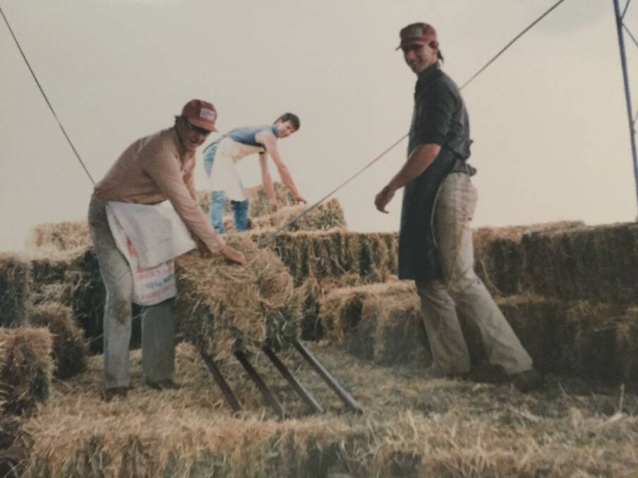 STOCK FEED: Ken Correll with sons Paul and David carting hay bales for stock in 1978.
