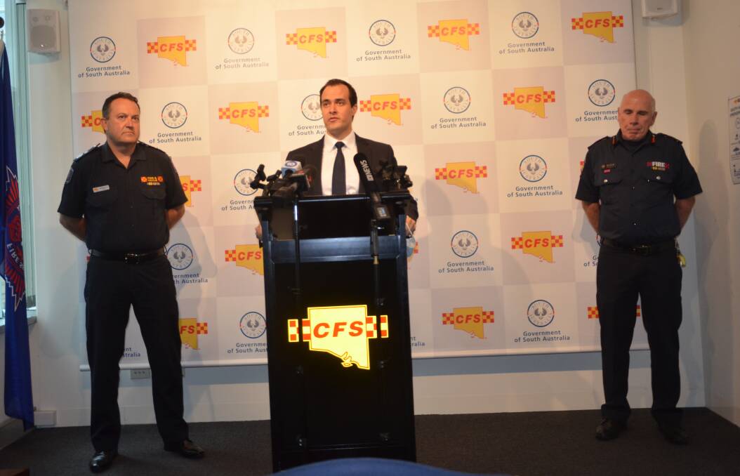 ALIGNING MESSAGES: CFS Deputy Chief Officer Andrew Stark, Emergency Services Minister Vincent Tarzia, and MFS Deputy Chief Officer Paul Fletcher, at the announcement this morning.