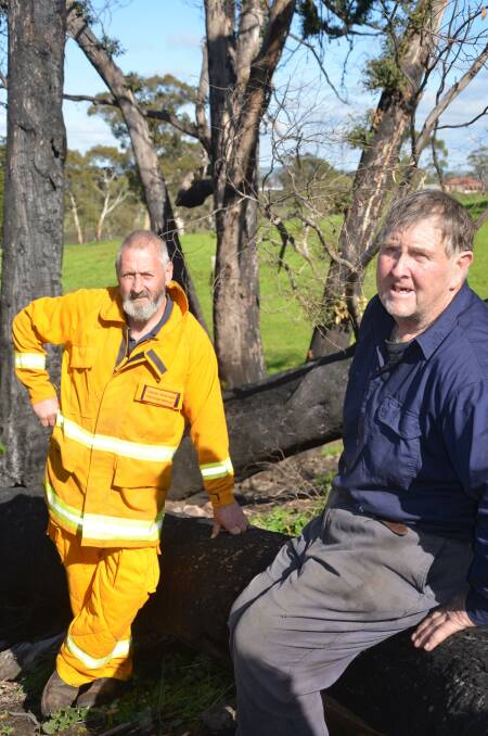 GRATEFUL: Woodside cattle producer Ken Camens with Woodside Brigade captain Craig Paschke, who helped fight the Cudlee Creek fire on Mr Camens' property.